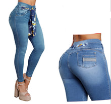 Load image into Gallery viewer, A three-panel collage showing a model wearing Bon Bon Up high-waisted blue jeans with a colorful patterned fabric tie at the waist. The panels show a full-body view, a side/back view, and a rear view, with the Bon Bon Up brand logo and reference number 9141 displayed.

